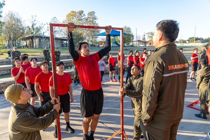 U.S. Marine Corps poolees with Recruiting Station Houston, 8th Marine Corps District, conduct a pull-up competition during a poolee function with Marines at Gene Green Dog Park in Houston, Texas, Jan. 11, 2025. The poolees competed in teams throughout the day conducting pull-ups, a relay race, a simulated-resupply run, and a tug-of-war. (U.S. Marine Corps photo by Sgt. Ryan H. Pulliam)