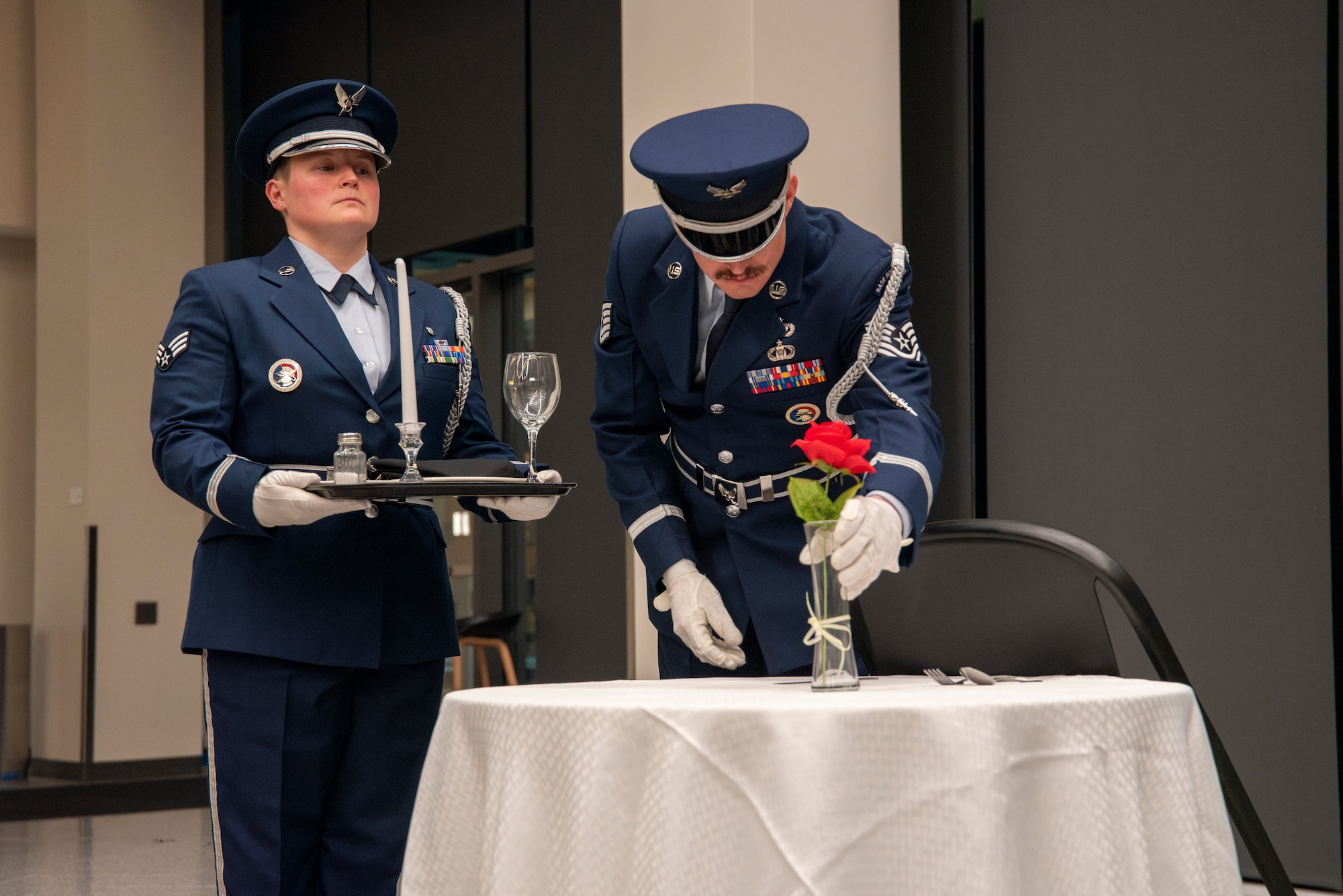 Utah Air National Guard Honor Guard pays tribute to the POW/MIA table during the Airman of the Year banquet, a solemn reminder of those who made the ultimate sacrifice and those still unaccounted for.