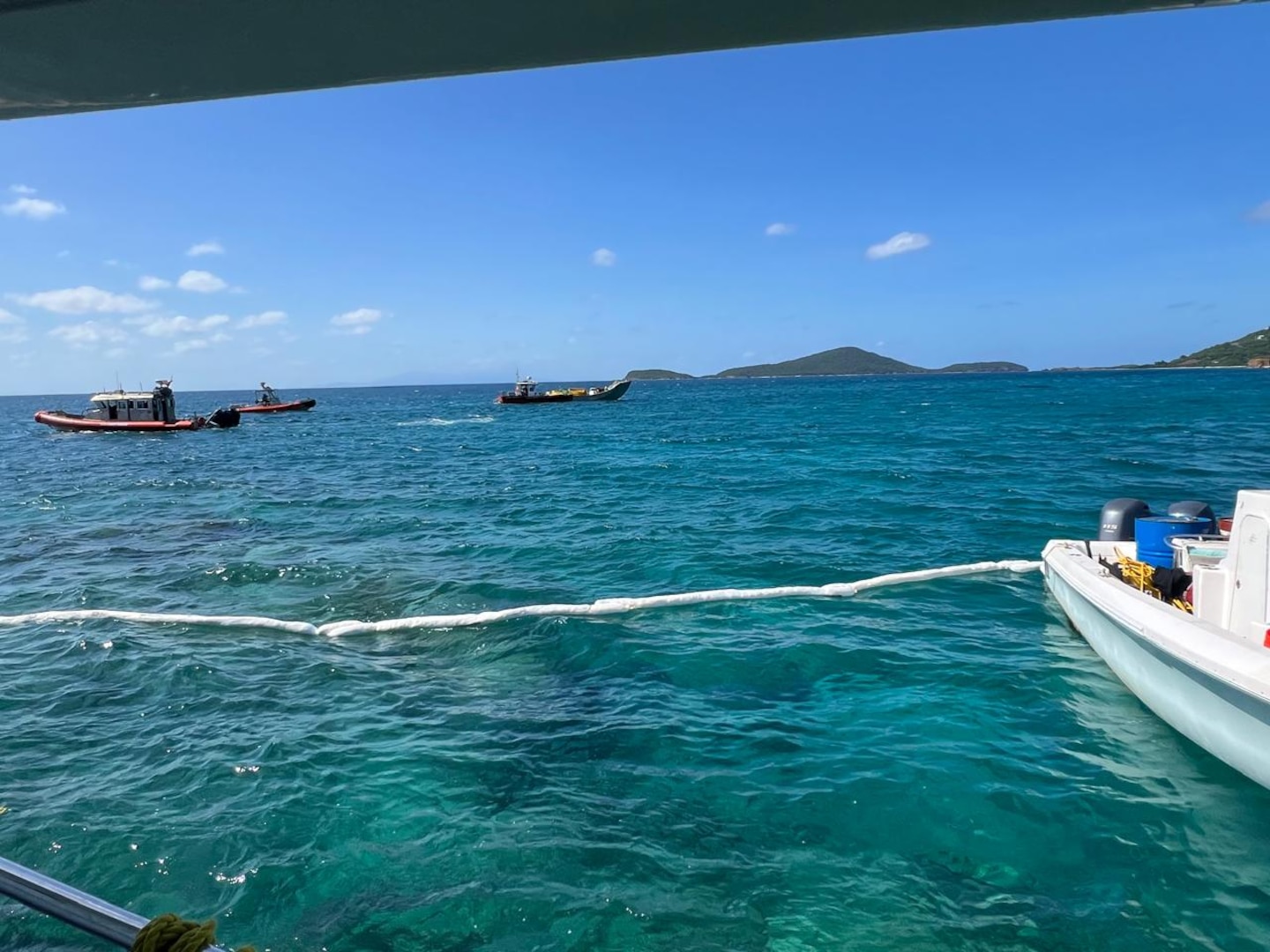 Coast Guard and contract vessels during the fuel removal operations for the aground motor yacht Runaway off Culebra, Puerto Rico, Jan. 10, 2025.  Contractors removed approximately 160 gallons of petroleum products from the fuel tanks and the vessel’s engine. Coast Guard Incident Management Division personnel from Sector San Juan are monitoring vessel removal efforts by the owner, after the vessel ran aground on a reef in waters west of Ensenada Honda in Culebra, Puerto Rico, Dec. 30, 2024. (Courtesy photo)