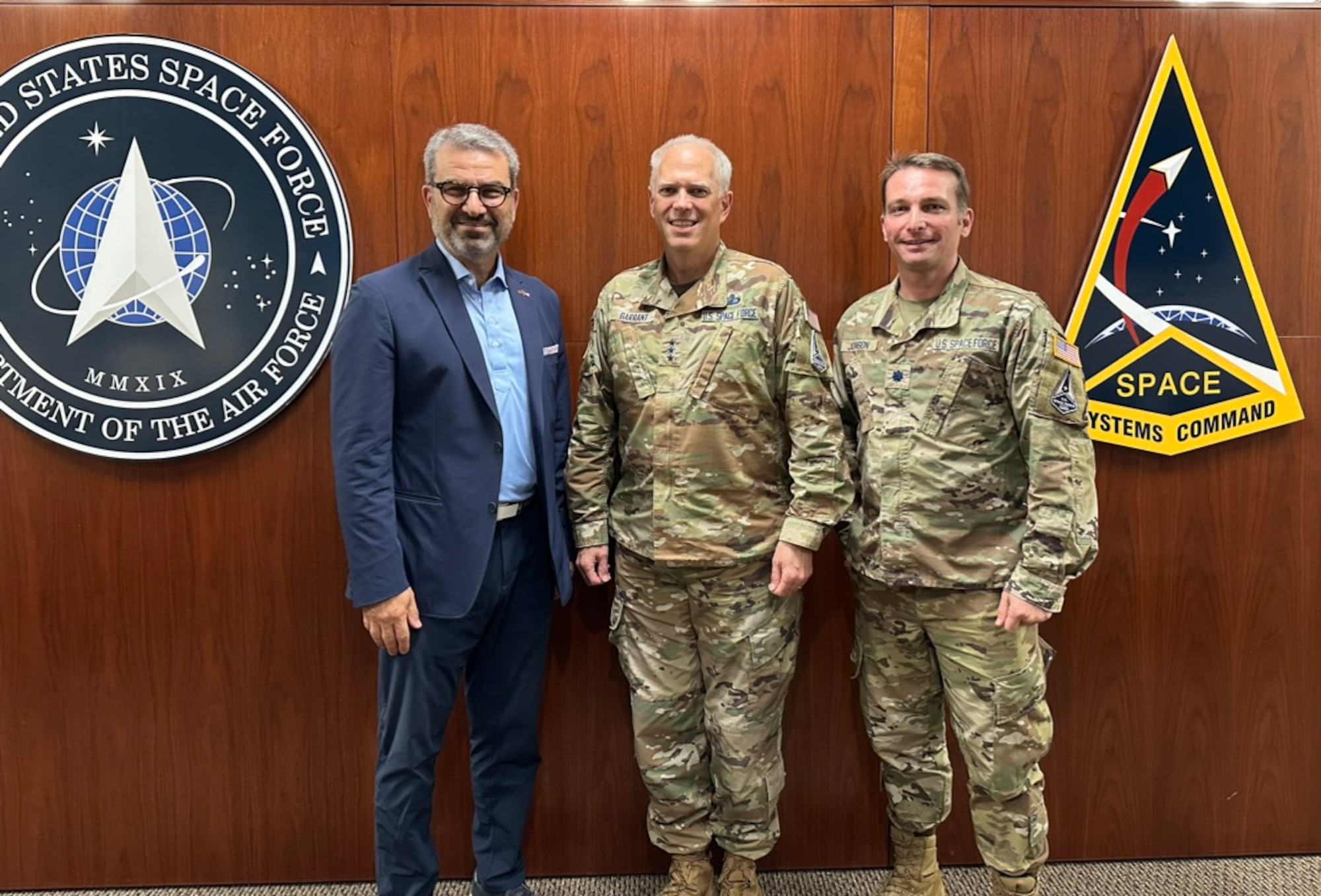 University of Southern California professor Frank Zerunyan (left) joins Space Systems Command’s commander Lt. Gen. Philip Garrant, and Lt. Col. Jamie Johnson, at SSC headquarters in El Segundo, Calif. The three have worked together on developing career education opportunities for the workforce at SSC.