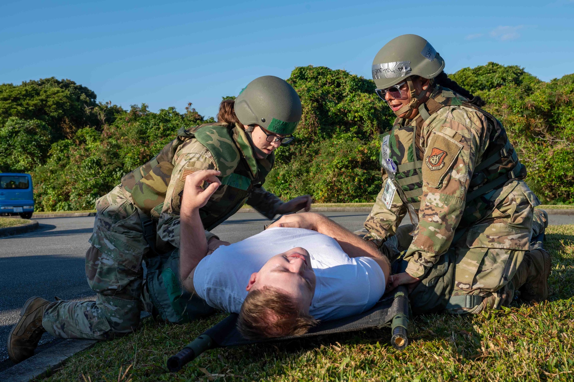 U.S. Air Force Airmen with the 18th Medical Group transfer a simulated patient onto a stretcher during a mass casualty scenario during a routine readiness exercise at Kadena Air Base, Japan, Jan. 14, 2025.