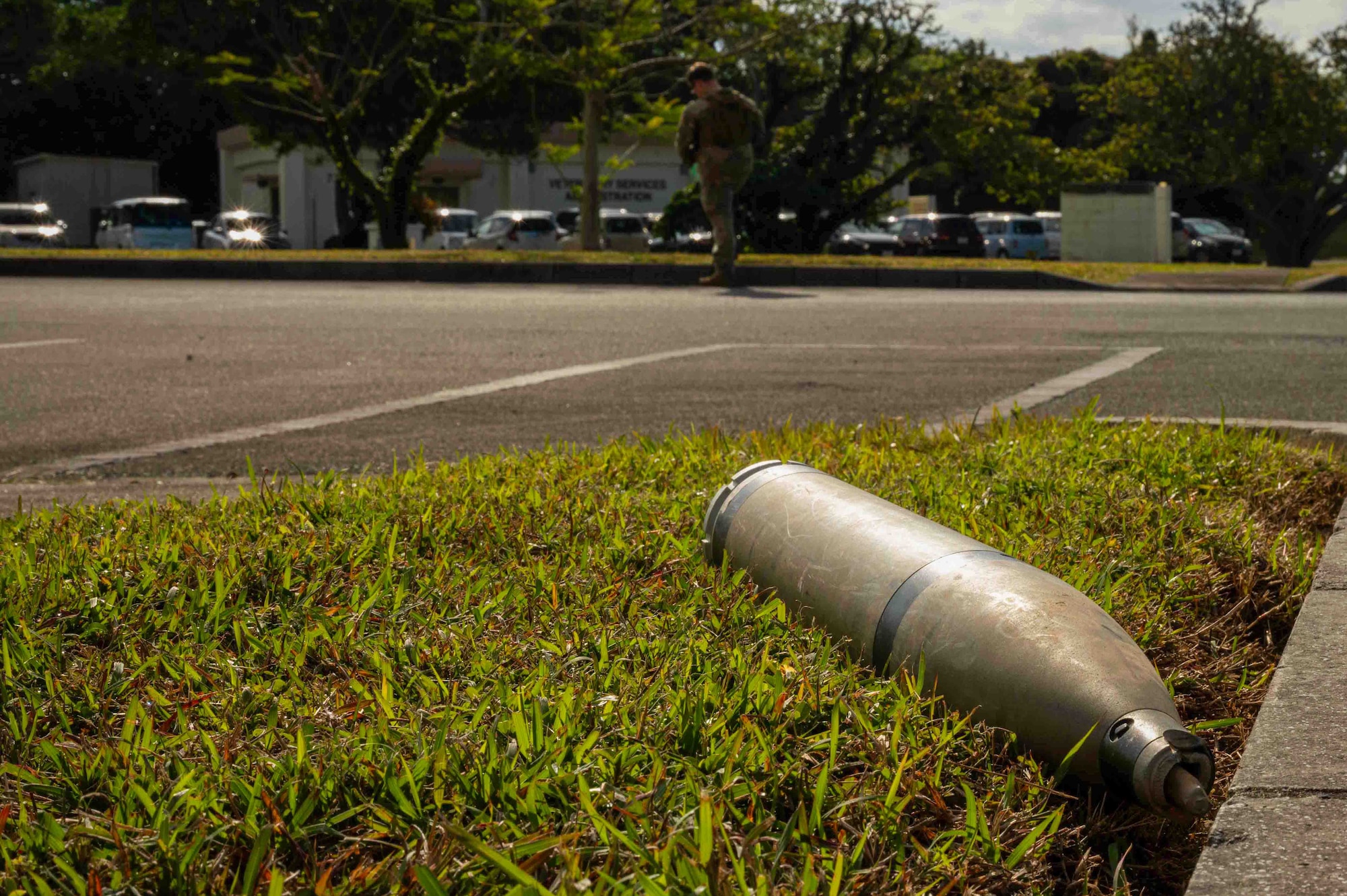 A simulated unexploded ordnance sits on a patch of grass during a routine readiness exercise at Kadena Air Base, Japan, Jan. 14, 2025.