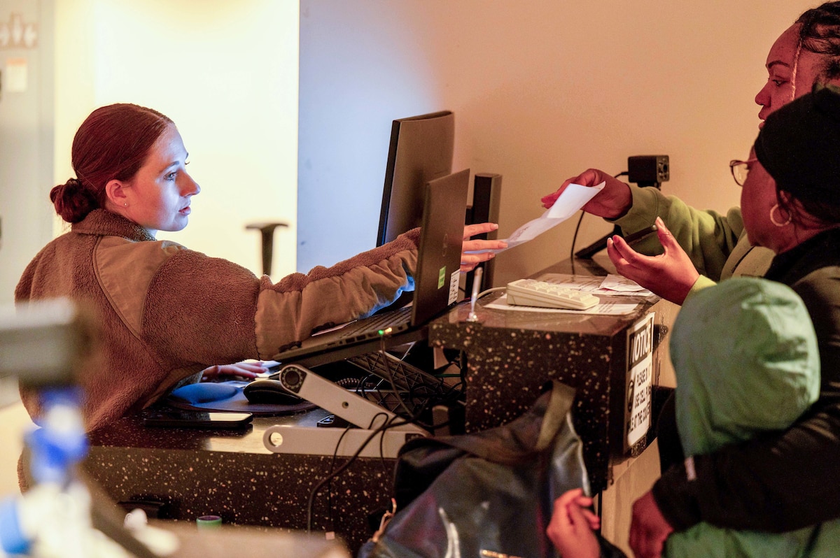 U.S. Air Force Senior Airman Madison Duncan, 42nd Security Forces Squadron entry point controller, checks a vehicle registration for visitor passes at the visitor center on Maxwell Air Force Base.