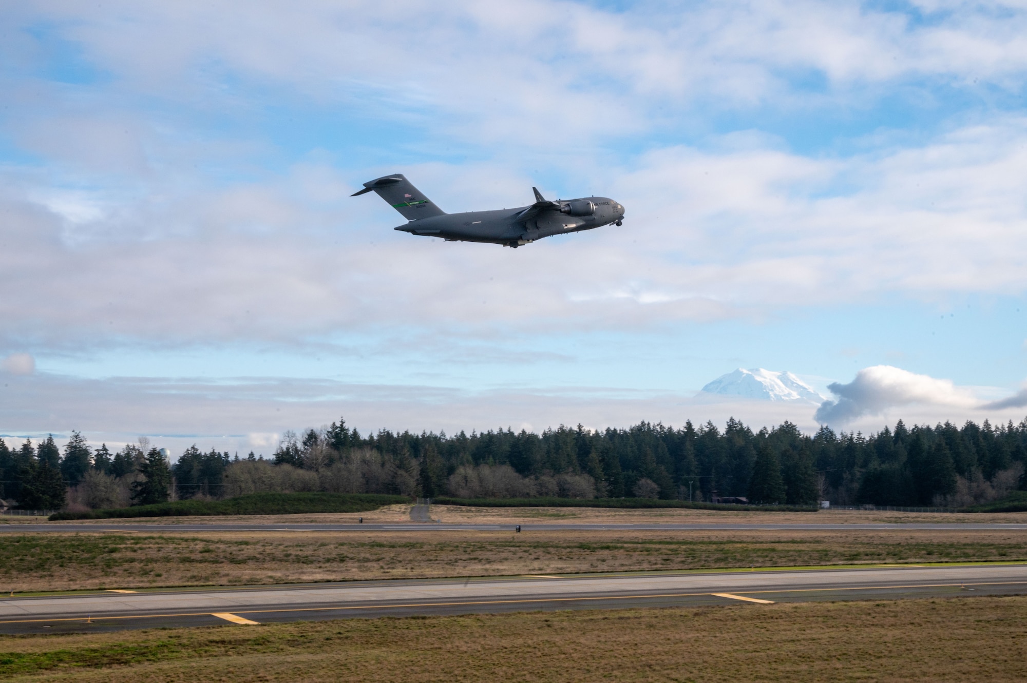 The 62d Airlift Wing executes a nine-ship C-17 Globemaster III formation from Joint Base Lewis-McChord, Wash., Jan. 8, 2025. The exercise demonstrated the wing's rapid global mobility capabilities, including precise airdrop operations and synchronized departures, highlighting the readiness and skill of aircrew and maintainers in supporting U.S. and allied missions worldwide.