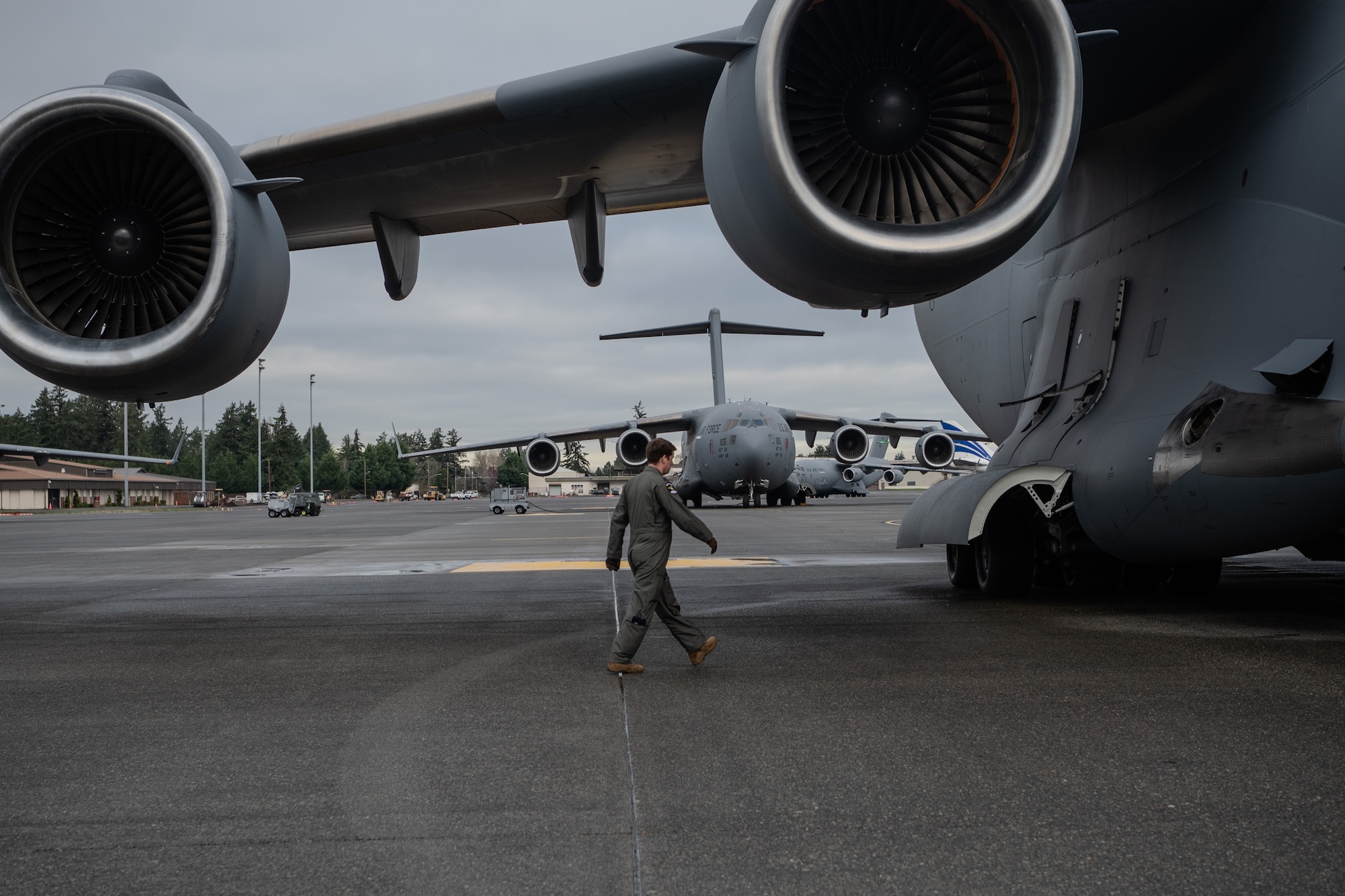 The 62d Airlift Wing executes a nine-ship C-17 Globemaster III formation from Joint Base Lewis-McChord, Wash., Jan. 8, 2025. The exercise demonstrated the wing's rapid global mobility capabilities, including precise airdrop operations and synchronized departures, highlighting the readiness and skill of aircrew and maintainers in supporting U.S. and allied missions worldwide.