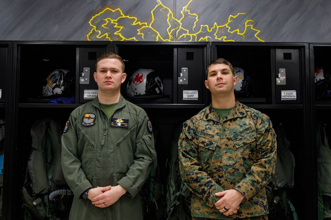 U.S. Marine Corps Staff Sgt. Billy Emerton, left, a flight equipment technician, with Marine Fighter Attack Squadron (VMFA) 242, Marine Aircraft Group 12, 1st Marine Air Wing and Gunnery Sgt. David Emerton, equal opportunity advisor for Headquarters and Headquarters Squadron, Marine Corps Air Station Iwakuni, both natives of Texas, pose for a photo at MCAS Iwakuni, Japan, Dec. 5, 2024. Answering the nation's call has always been a proud tradition in many American homes. Marines having siblings who also serve in the armed forces is nothing new, but for the Emerton brothers, their service has been closer than most. (U.S. Marine Corps photo by Lance Cpl. David Getz)