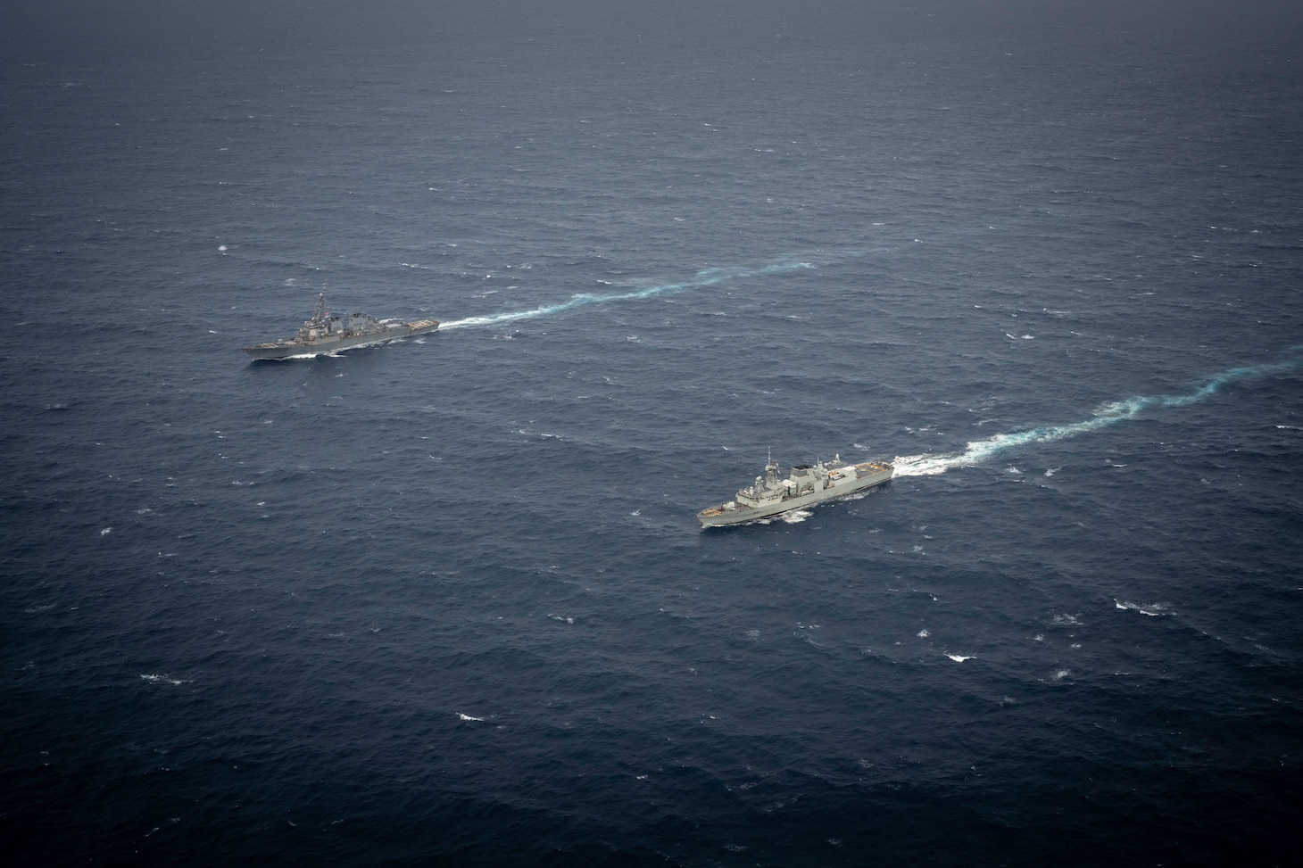 United States Ship Higgins (DDG76) and His Majesty’s Canadian Ship Ottawa conduct manoeuvers in international waters during exercise Noble Wolverine in the South China Sea on 11 January 2025. Photo Credit: Sailor 3rd Class Jacob Saunders, Canadian Armed Forces Photo.