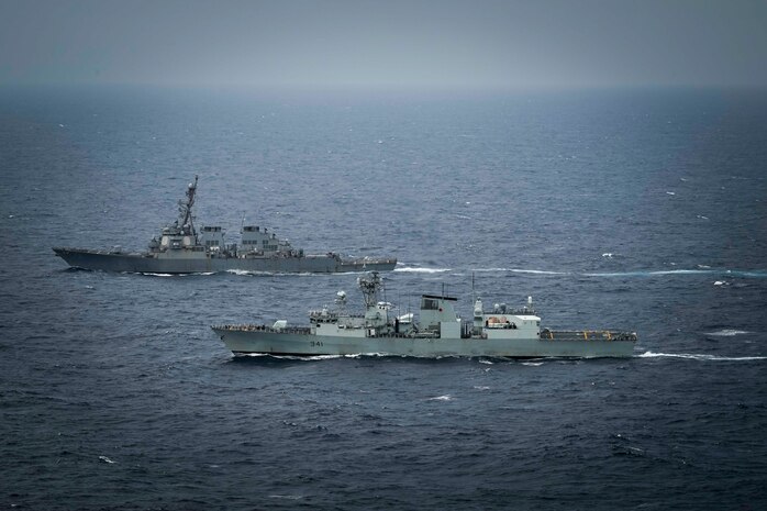 United States Ship Higgins (DDG76) and His Majesty’s Canadian Ship Ottawa conduct manoeuvers in international waters during exercise Noble Wolverine in the South China Sea on 11 January 2025. Photo Credit: Sailor 3rd Class Jacob Saunders, Canadian Armed Forces Photo.