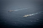 United States Ship Higgins (DDG76) and His Majesty’s Canadian Ship Ottawa conduct manoeuvers in international waters during exercise Noble Wolverine in the South China Sea on 11 January 2025. Photo Credit: Sailor 3rd Class Jacob Saunders, Canadian Armed Forces Photo.