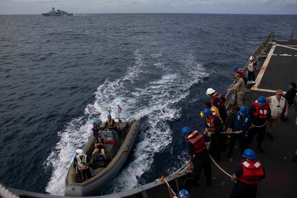 250109-N-HT008-1012 SOUTH CHINA SEA (Jan. 9, 2025) Sailors aboard the Arleigh Burke-class guided-missile destroyer USS Higgins (DDG 76) prepare to load personnel into a rigid hull inflatable boat during a bilateral exercise with the Royal Canadian Navy Halifax-class frigate HMCS Ottawa (FFH 341) in the South China Sea, Jan. 9. Higgins is forward-deployed and assigned to Destroyer Squadron (DESRON) 15, the Navy’s largest DESRON and the U.S. 7th Fleet’s principal surface force. (U.S. Navy photo by Mass Communication Specialist 3rd Class Trevor Hale)