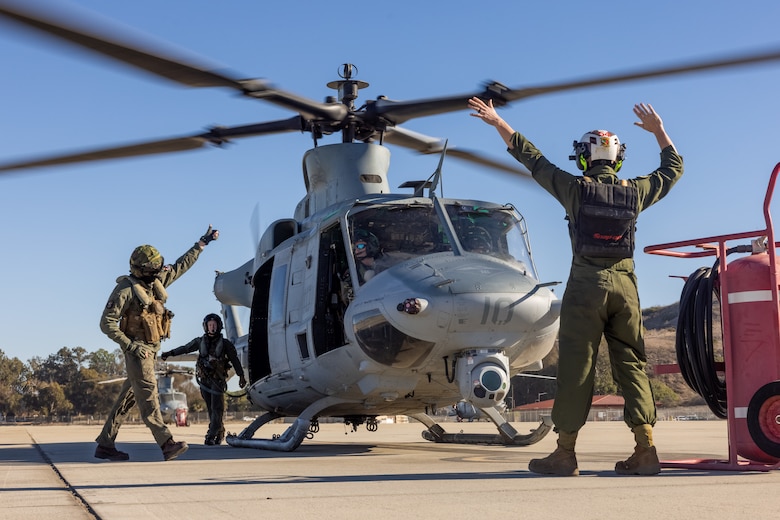 U.S. Marines with Marine Light Attack Helicopter Squadron (HMLA) 367, Marine Aircraft Group 39, 3rd Marine Aircraft Wing, conducts aircraft checks on a UH-1Y Venom at Marine Corps Air Station Camp Pendleton, California, Jan. 10, 2025.