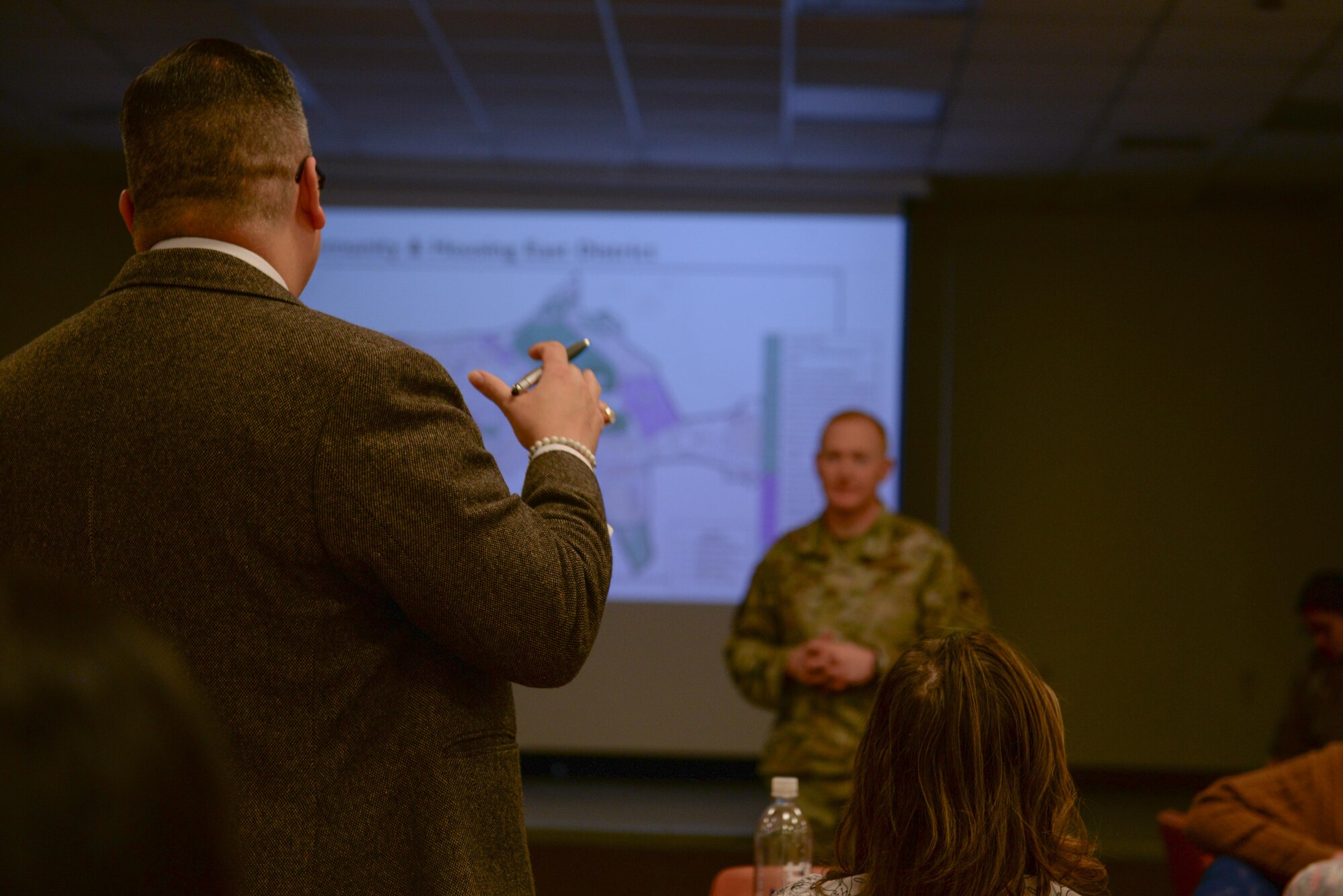 William Castro, DoDEA Administrative Officer, shares community and housing related suggestions with U.S. Air Force Maj. Brigham Moore, 51st Civil Engineer Squadron director of operations, during the 2035 Osan Planning Charrette at Osan Air Base, Republic of Korea, Jan. 8, 2025. The charrette allowed key military, civilian, and contractor stakeholders to brainstorm solutions to future infrastructure plans. The aggregated ideas will impact the placement of roads, buildings, and taxiways  for the next 10 years. (U.S. Air Force photo by Staff. Sgt. Kahdija Slaughter)