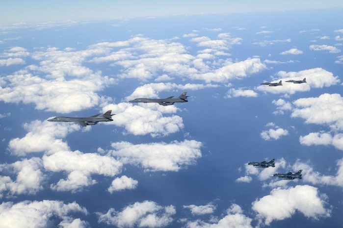 Two U.S. B-1B Lancers are escorted by two Republic of Korea Air Force F-15Ks Slam Eagles and two Japan Air Self-Defense Force Mitsubishi F-2s in airspace between South Korea and Japan, Jan. 15, 2025.