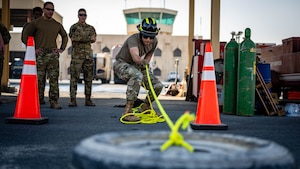 Airman pulls tire.