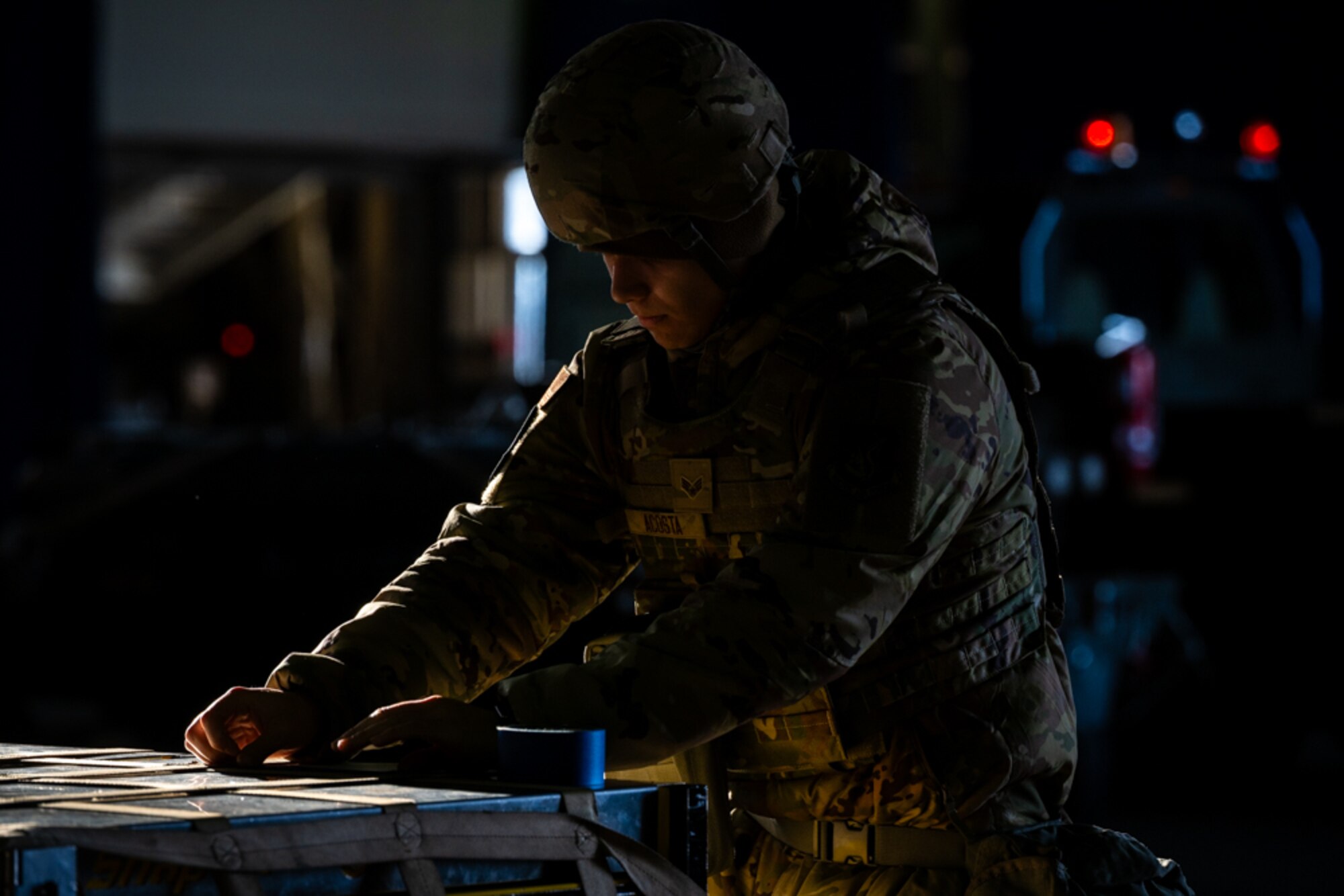 Airmen tapes cargo documents