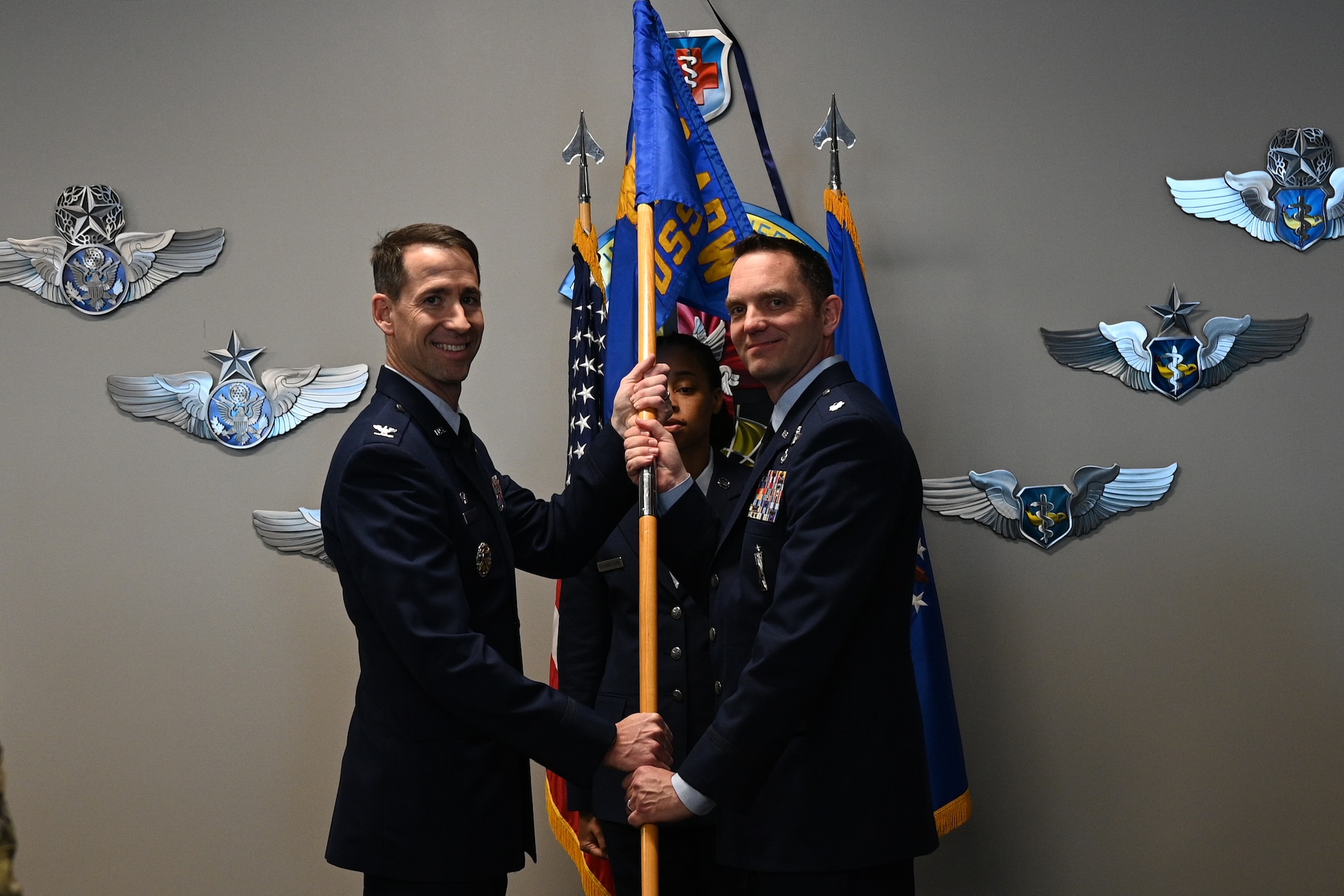 Lt. Col. Travis Posey (r) takes command of the 459th Operations Support Squadron during an assumption of command ceremony on Jan. 11, 2025, at Joint Base Andrews, Md. Col. Randall Heusser (l), 459th Operations Group Commander, was the presiding official.