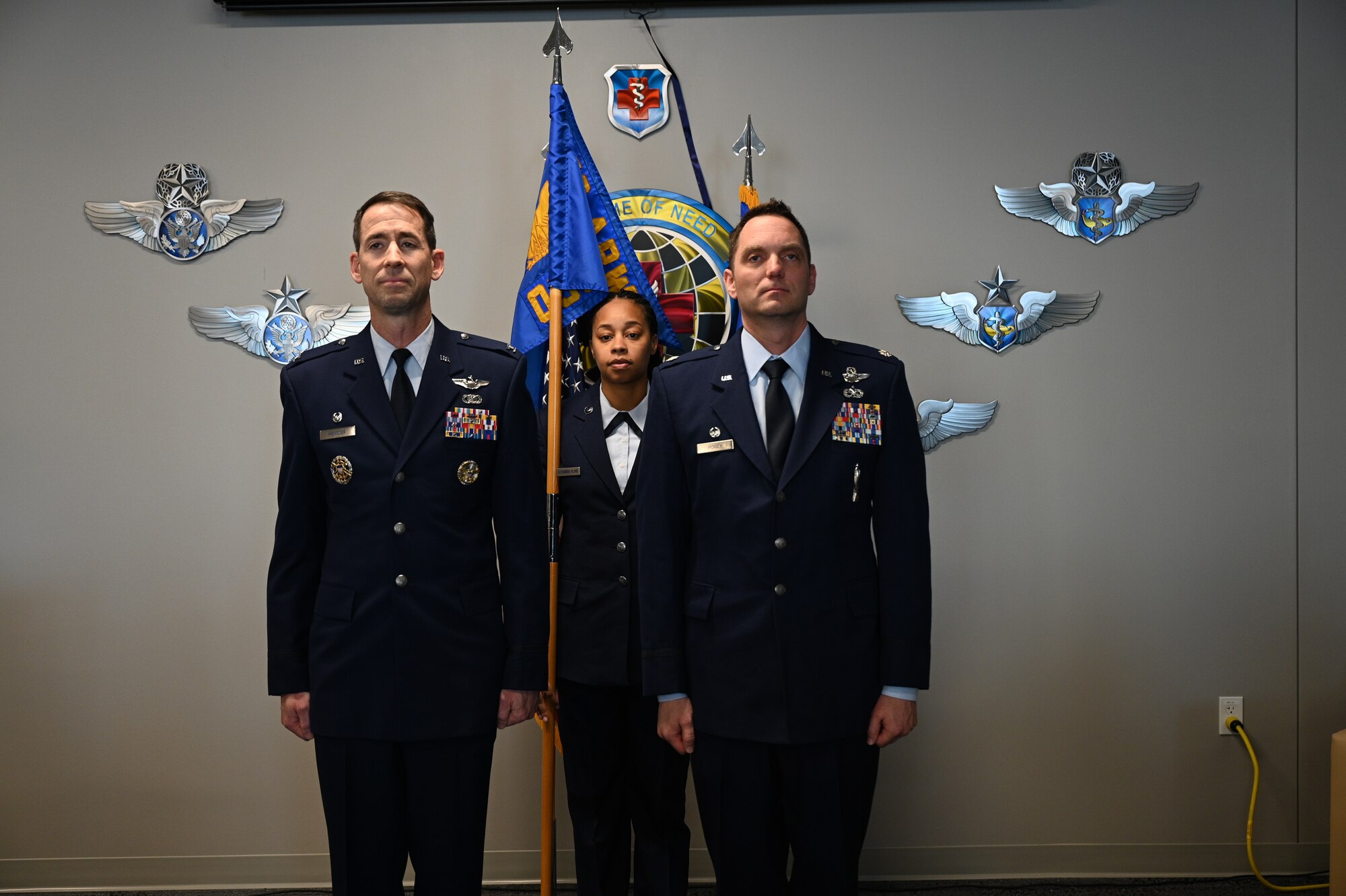Lt. Col. Travis Posey (r) takes command of the 459th Operations Support Squadron during an assumption of command ceremony on Jan. 11, 2025, at Joint Base Andrews, Md. Col. Randall Heusser (l), 459th Operations Group Commander, was the presiding official.