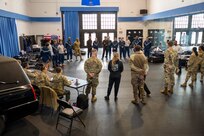 U.S. Air Force and U.S. Space Force Honor Guard guardsmen receive a pre-deployment brief at Joint Base Anacostia-Bolling, Washington, D.C., Jan. 1, 2025. The members gathered for a pre-deployment inspection in preparation to support the State Funeral of former President Jimmy Carter in Plains, Ga. Carter, the longest-lived president in U.S. history, passed away on Dec. 29, 2024, at the age of 100. (U.S. Air Force photo by Staff Sgt. Jordan Powell)