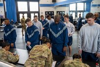 U.S. Air Force Honor Guard and U.S. Space Force Honor Guard guardsmen go through a pre-deployment readiness line in preparation for the State Funeral of former President Jimmy Carter at Joint Base Anacostia-Bolling, Washington, D.C., Jan. 1, 2025. Carter, the longest-lived president in U.S. history, passed away on Dec. 29, 2024, at the age of 100. (U.S. Air Force photo by Staff Sgt. Jordan Powell)