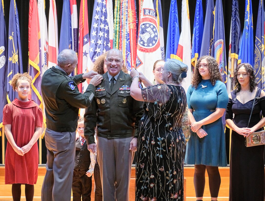 Chief of Staff of the Army Gen. Randy George and Stacy Davis pin Maj. Gen. Johnny Davis, U.S. Army Recruiting Command commanding general, with his third star promoting him to lieutenant general. Stacy is the wife of Lt. Gen. Davis.