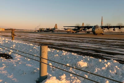 A 182nd Airlift Wing C-130H Hercules transporting Illinois National Guardsmen departs Peoria, Illinois, for Washington, D.C., Jan. 15, 2025. The approximately 110 Soldiers and 30 Airmen mobilized to the U.S. capital in support of security operations for the 60th presidential inauguration.