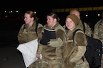 Senior Airmen Emma Oehler, 185th Air Refueling Wing medical technician, waits to depart the Sioux City, Iowa, airport with Airmen from the Iowa Air National Guard’s 185th Air Refueling Wing Medical Group Jan. 15, 2025. Iowa Air Guard medical technicians are flying to Washington to provide medical support for National Guard members in the capital region as part of the 60th Presidential Inauguration.