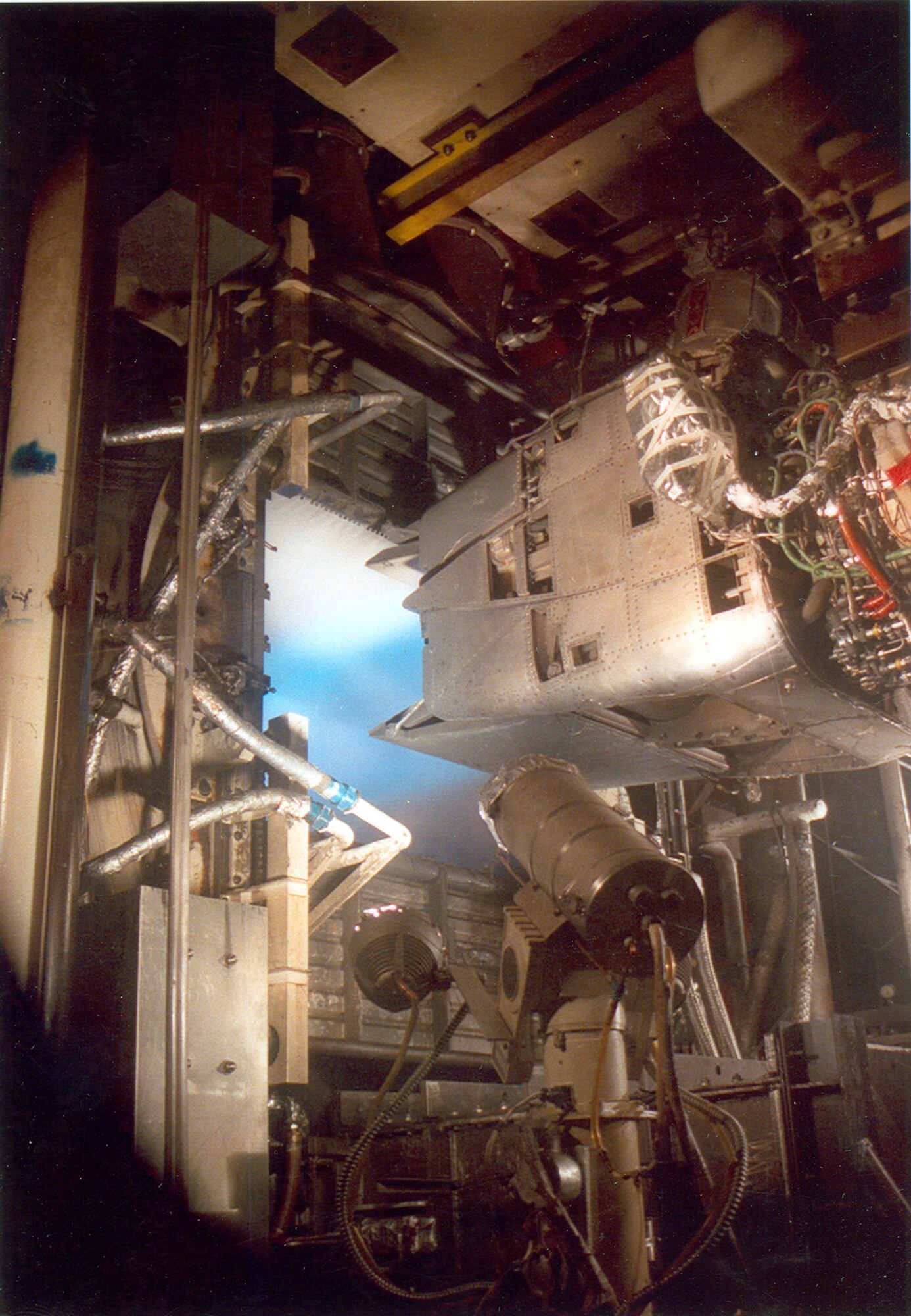 A Pratt & Whitney YF119 Prototype Engine for the F-22 Raptor with a demonstrator nozzle runs during a test in the Aeropropulsion Systems Test Facility at Arnold Air Force Base, Tenn., in 1989. Jan. 16, 2025, marks the 40th anniversary of the first full air-on operation in ASTF. The test marked the first time air had been circulated through the air supply, test cell and exhauster equipment in ASTF in a single run. (U.S. Air Force photo)