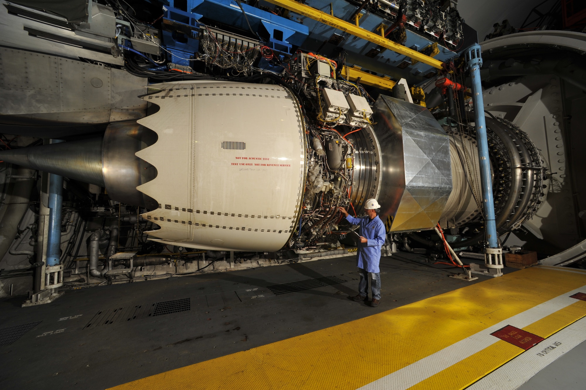 Eric Brumley inspects a Rolls-Royce Trent 1000-TEN engine prior to testing in 2015 at Arnold Air Force Base in the Aeropropulsion Systems Test Facility. Jan. 16, 2025, marks the 40th anniversary of the first full air-on operation in ASTF. This test marked the first time air had been circulated through the air supply, test cell and exhauster equipment in ASTF in a single run. (U.S. Air Force photo) (U.S. Air Force photo)
