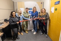 Capt. JD Crinklaw, left, commander, Puget Sound Naval Shipyard & Intermediate & Intermediate Maintenance Facility, participates in an official ribbon-cutting ceremony inside Building 844, Nov. 22, 2024, for one of three new expressing station pods to support nursing mothers working at PSNS & IMF in Bremerton, Washington. (U.S. Navy photo by Jeb Fach)
