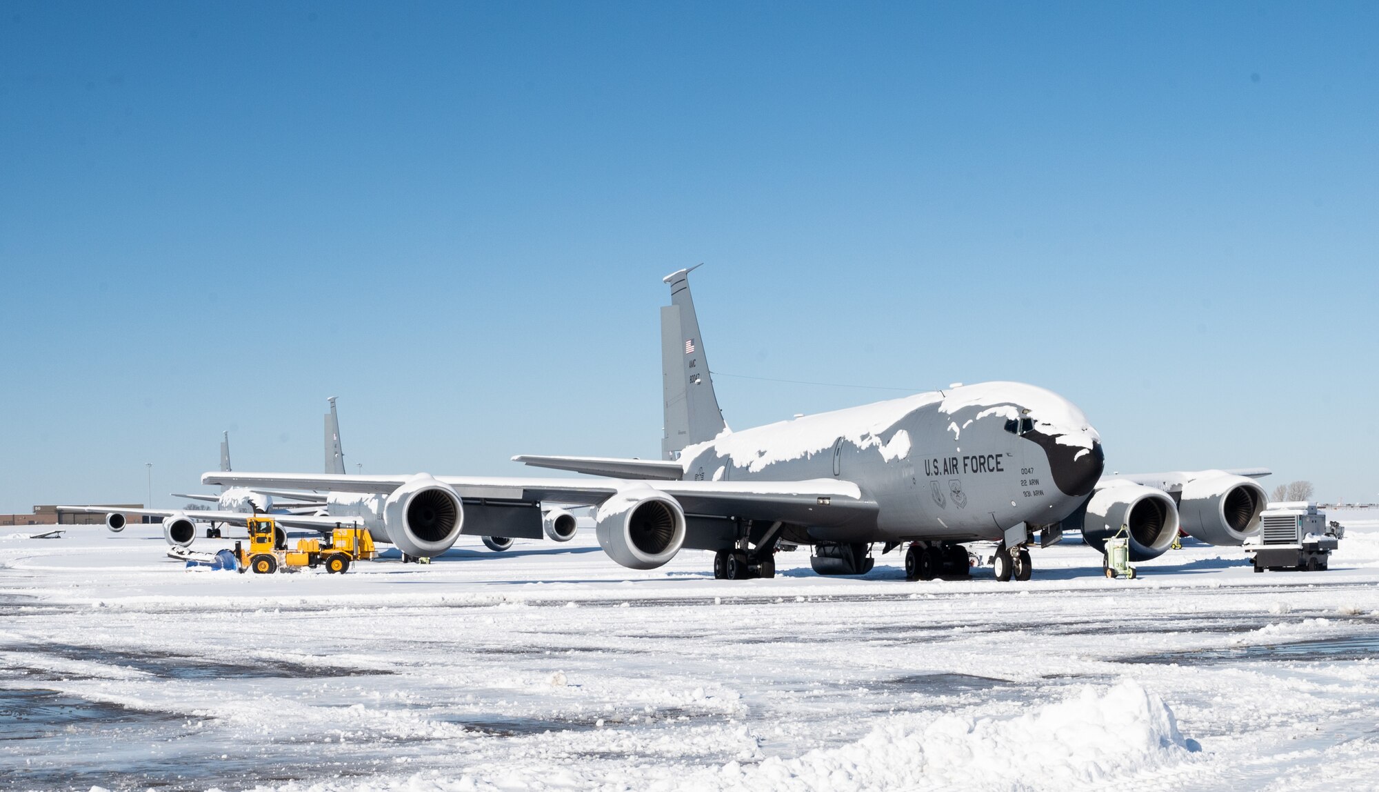 An Airman assigned to the 22nd Civil Engineer Squadron drives a snowplow on the flightline after a winter storm at McConnell Air Force Base, Kansas, Jan. 10, 2025. Over the course of five days, approximately nine inches of snowfall covered the surrounding area of Sedgewick County. (U.S. Air Force photo by Staff Sgt. Tryphena Mayhugh)