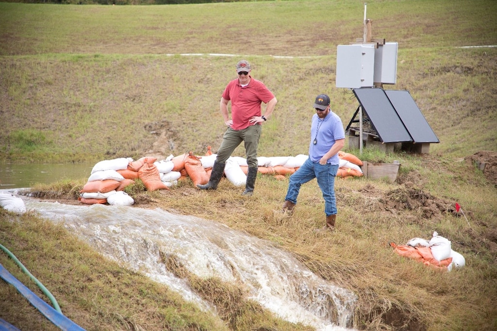 ERDC researchers conduct an overtopping field study of an experimental embankments to evaluate the field performance and application scalability of an extracellular polymeric substance biopolymer.