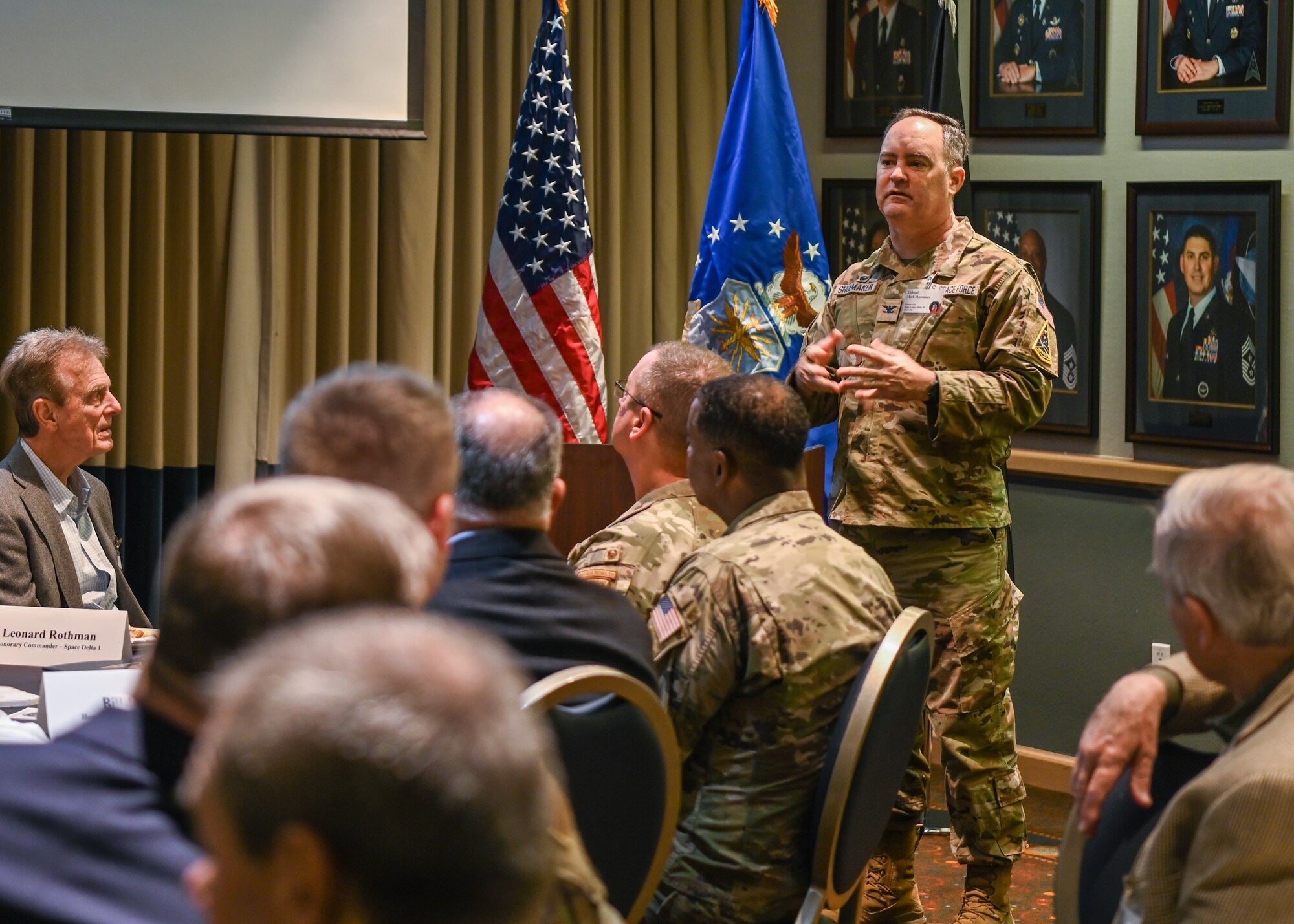 A Space Launch Delta 30 commander, briefs the honorary commanders during an annual Honorary Commanders Breakfast at Vandenberg Space Force Base.