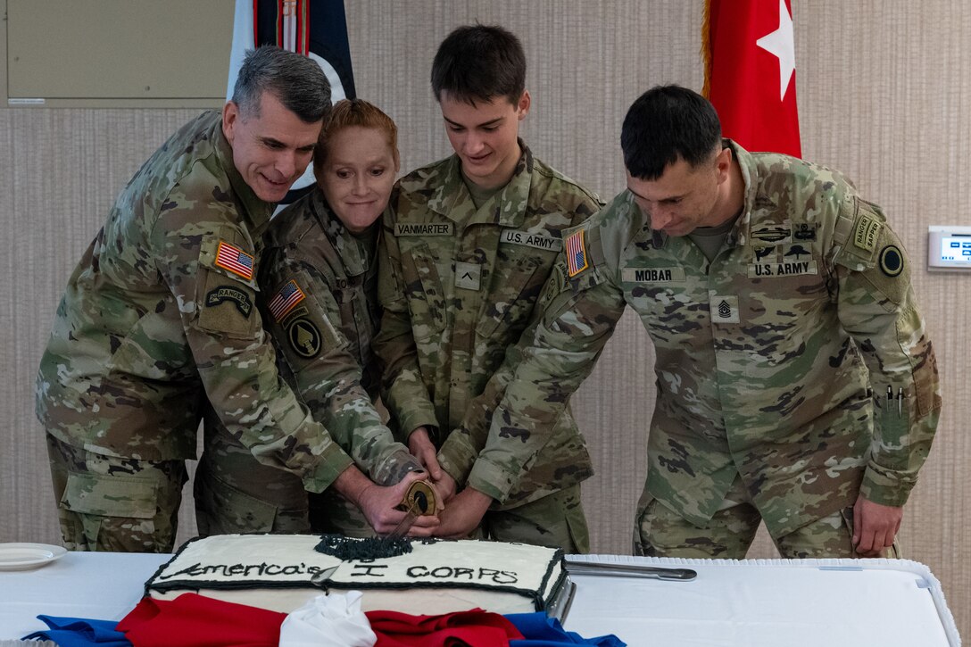 America’s First Corps command team and Soldiers cut an I Corps themed cake in celebration of the  corps’ 107th birthday at American Lake Conference Center on Joint Base Lewis-McChord, WA, Jan 15, 2025. The corps’ first conducted combat operations during World War I. (U.S. Army photo by Spc. Omarion Hall.)