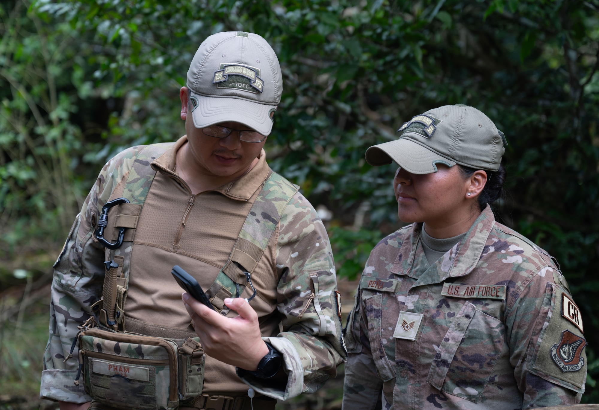 Leadership from the 36th Contingency Response Group, and 736th Security Forces Training Center instructors celebrate the Airmen that graduated the most recent jungle training course at Northwest Field, Andersen Air Force Base, Guam, Jan. 16, 2024. The course was designed to introduce Airmen to jungle specific obstacles and strategies in various ways.  (U.S. Air Force photo by Airmen 1st Class Manasseh Demissie)