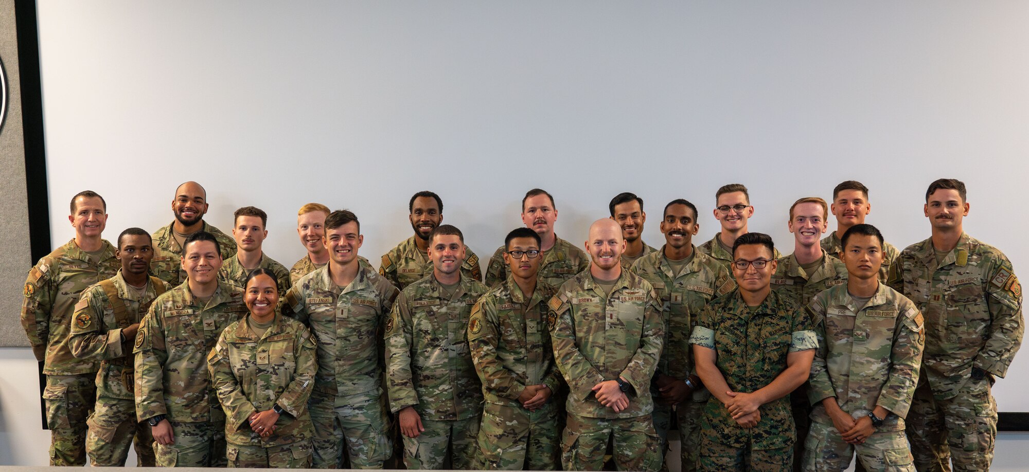 Leadership from the 36th Contingency Response Group, and 736th Security Forces Training Center instructors celebrate the Airmen that graduated the most recent jungle training course at Northwest Field, Andersen Air Force Base, Guam, Jan. 16, 2024. The course was designed to introduce Airmen to jungle specific obstacles and strategies in various ways.  (U.S. Air Force photo by Airmen 1st Class Manasseh Demissie)