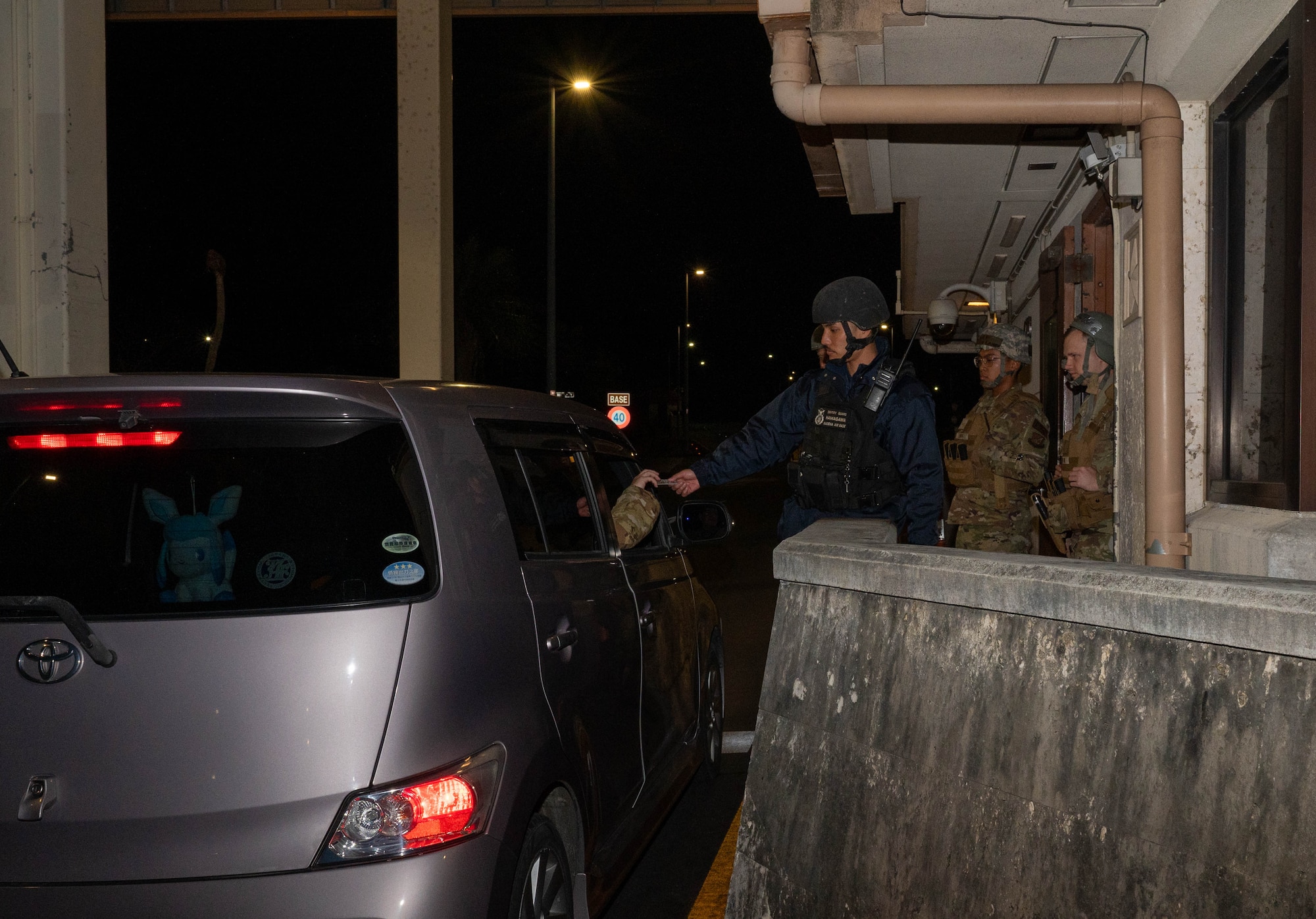 Civilian checks ID.