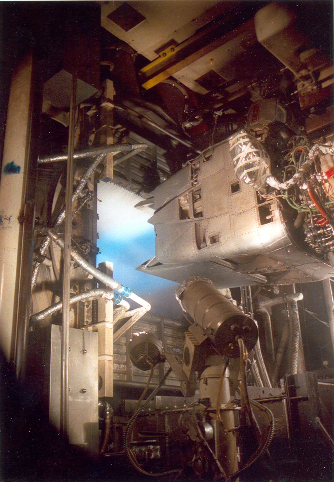 A Pratt & Whitney YF119 Prototype Engine for the F-22 Raptor with a demonstrator nozzle runs during a test in the Aeropropulsion Systems Test Facility at Arnold Air Force Base, Tenn., in 1989. Jan. 16, 2025, marks the 40th anniversary of the first full air-on operation in ASTF. The test marked the first time air had been circulated through the air supply, test cell and exhauster equipment in ASTF in a single run. (U.S. Air Force photo)