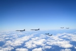 Two U.S. B-1B Lancers are escorted by two Republic of Korea Air Force F-15Ks Slam Eagles and two Japan Air Self-Defense Force Mitsubishi F-2s in airspace between South Korea and Japan, Jan. 15, 2025. The increasingly steady and sophisticated trilateral interoperability of the three nations’ aerial and maritime forces strengthens their collective deterrence and defense postures. (U.S. Air Force photo by Tech. Sgt. Stephanie Serrano)