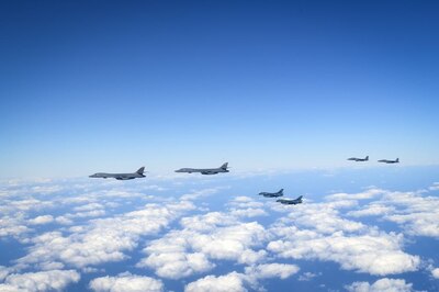 Two U.S. B-1B Lancers are escorted by two Republic of Korea Air Force F-15Ks Slam Eagles and two Japan Air Self-Defense Force Mitsubishi F-2s in airspace between South Korea and Japan, Jan. 15, 2025. The increasingly steady and sophisticated trilateral interoperability of the three nations’ aerial and maritime forces strengthens their collective deterrence and defense postures. (U.S. Air Force photo by Tech. Sgt. Stephanie Serrano)
