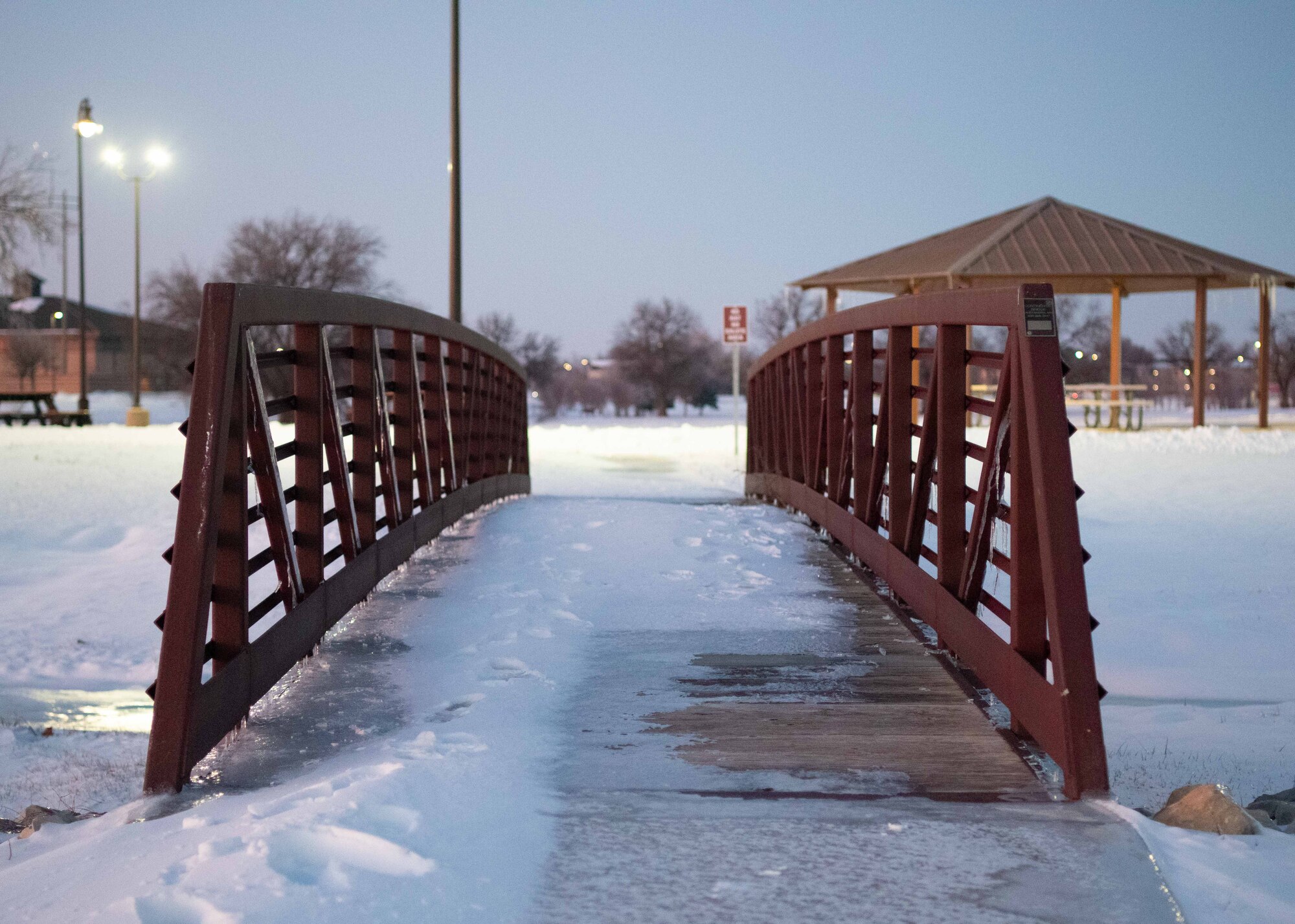 Snow and ice cover a bridge outside the base exchange at McConnell Air Force Base, Kansas, Jan. 8, 2025. Over the course of five days, approximately nine inches of snowfall covered the surrounding area of Sedgwick County. (U.S. Air Force photo by Airman 1st Class Patrick O'Neill)