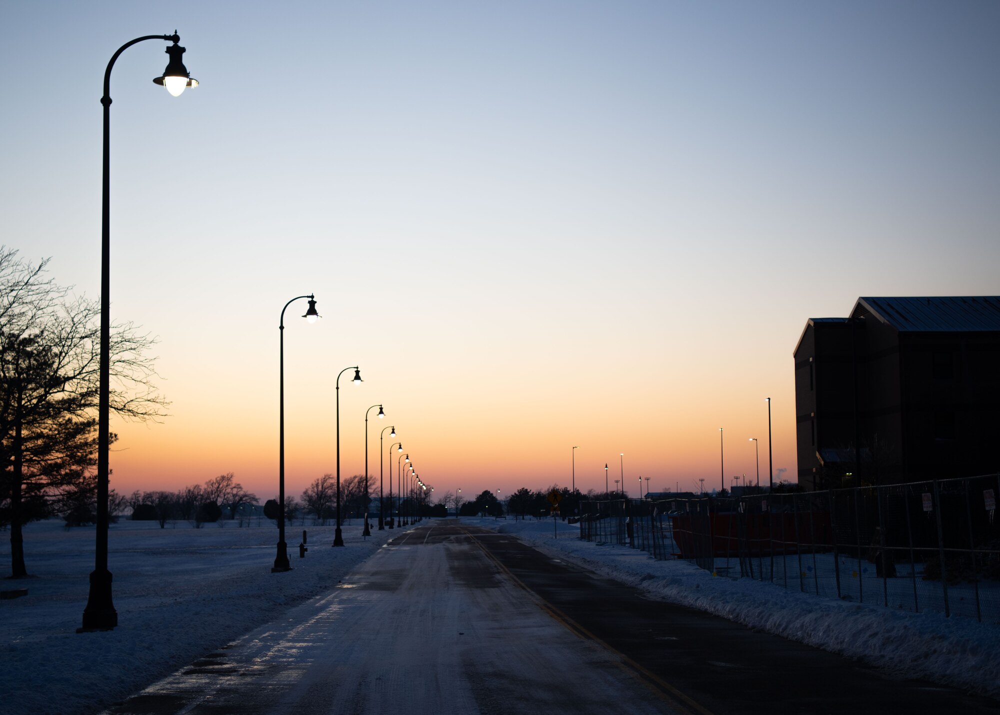 Ice covers the street at McConnell Air Force Base, Kansas, Jan. 8, 2025. Over the course of five days, approximately nine inches of snowfall covered the surrounding area of Sedgwick County. (U.S. Air Force photo by Airman 1st Class Patrick O'Neill)