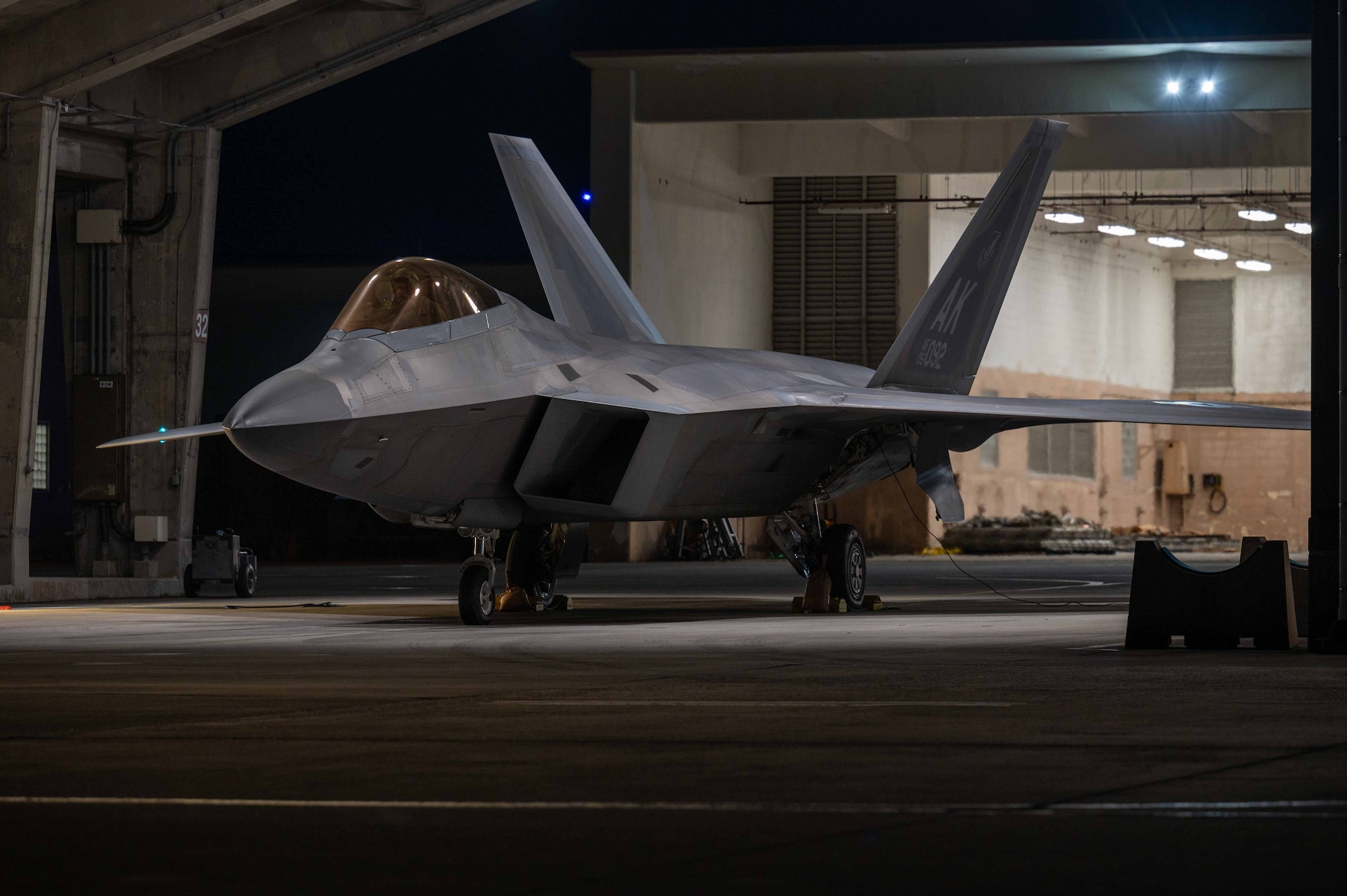 A U.S. Air Force F-22A Raptor assigned to the 525th Expeditionary Fighter Squadron sits parked in a flow-through during a base-wide readiness exercise at Kadena Air Base, Japan, Jan. 15, 2025.