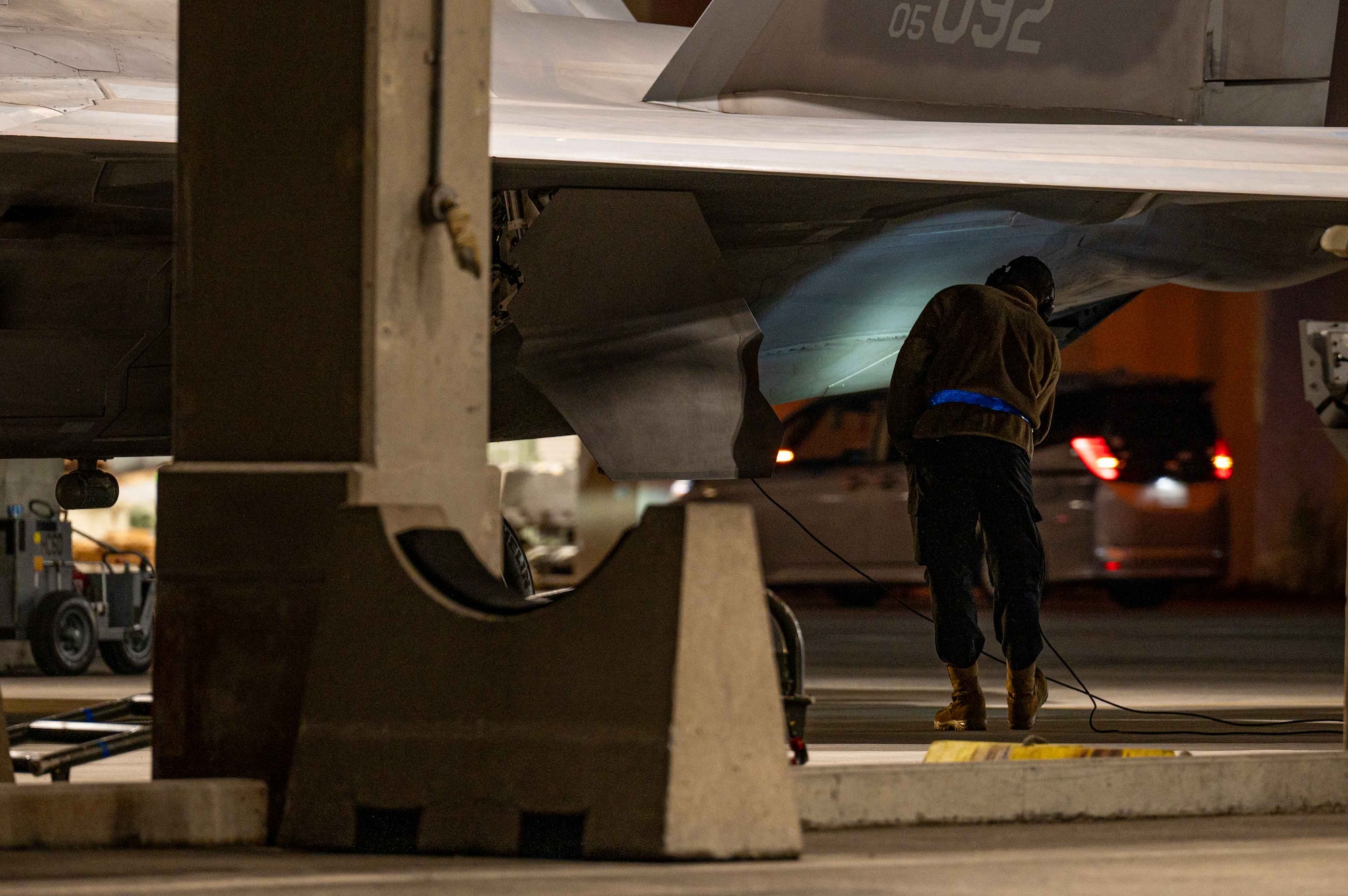 U.S. Air Force Senior Airman Jacob Upton, 525th Fighter Generation Squadron crew chief, conducts pre-flight checks on an F-22A Raptor during a base-wide readiness exercise at Kadena Air Base, Japan, Jan. 15, 2025.