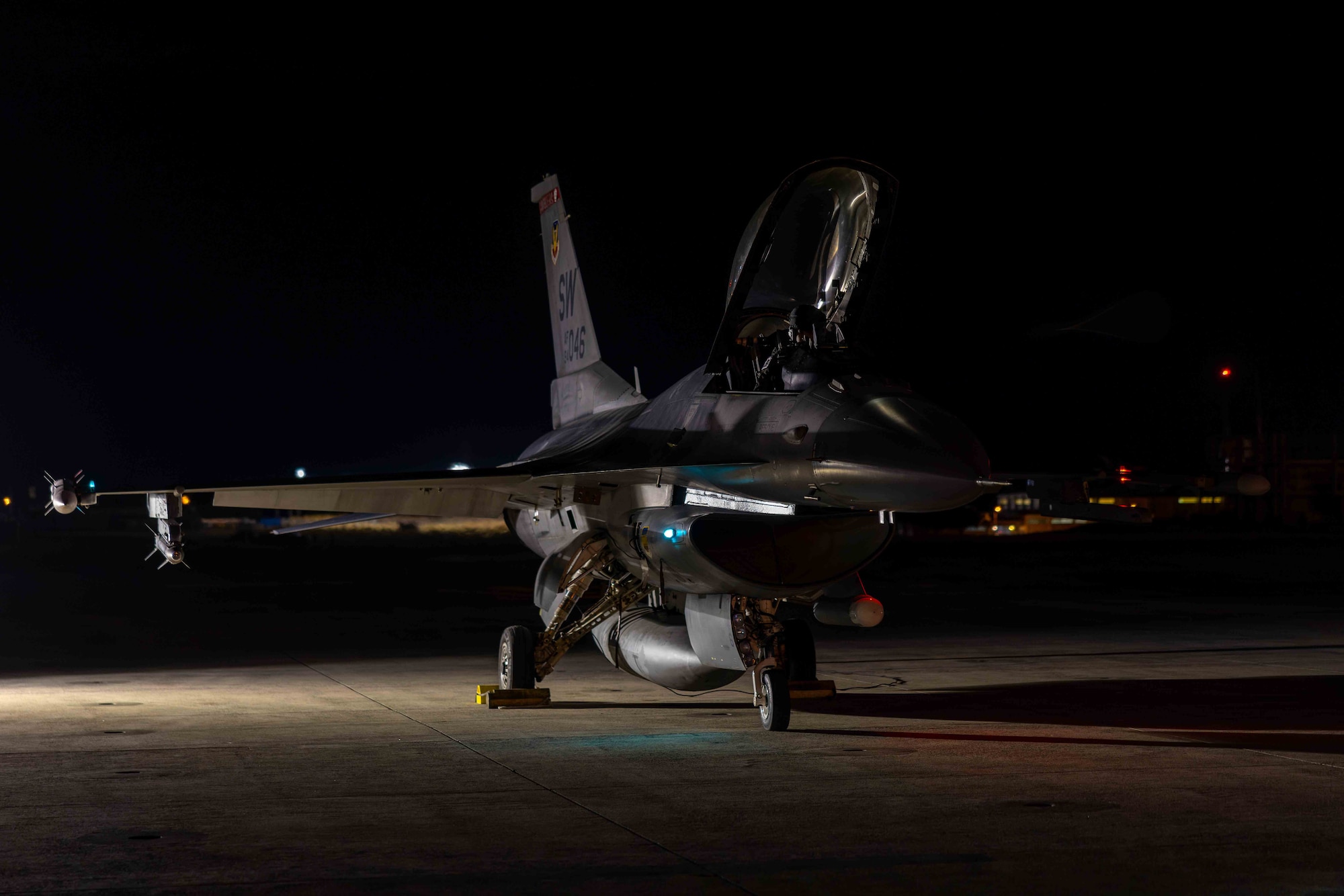 An aircraft sits on the flightline.