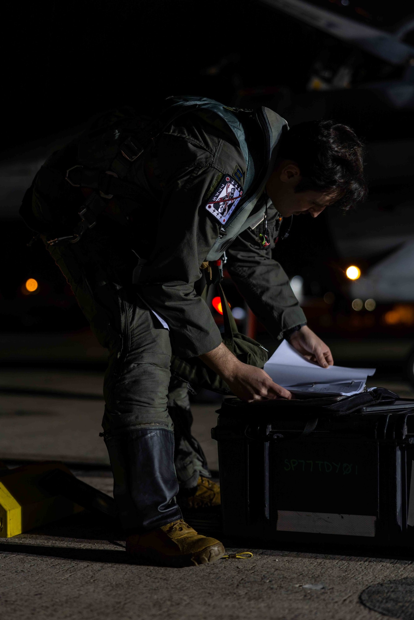 A pilot reviews documents before a flight.