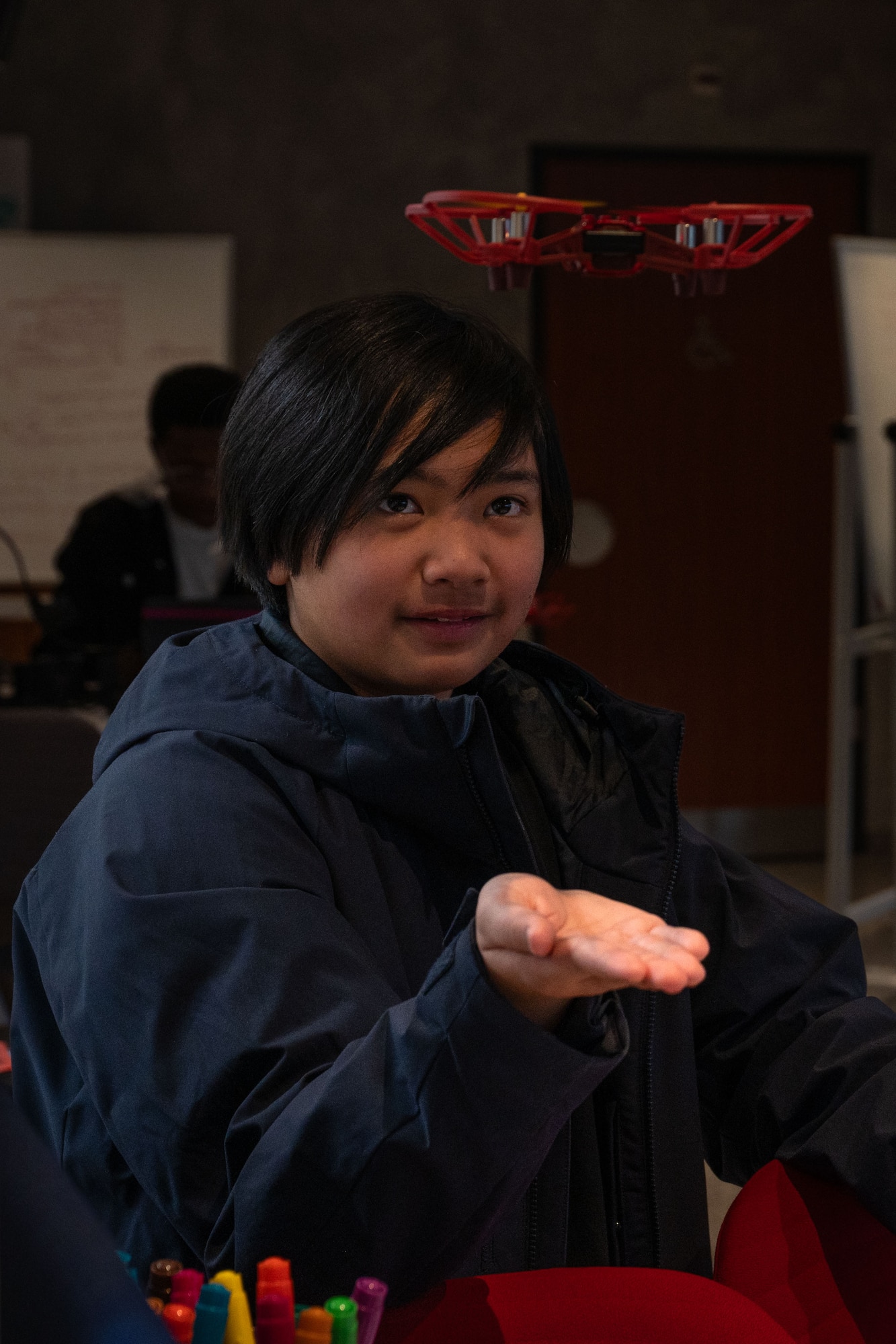 A student waits for a drone to land