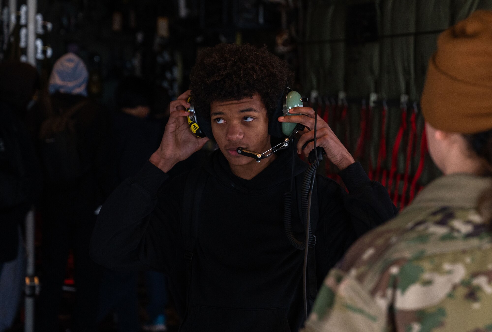 A student puts on a headset
