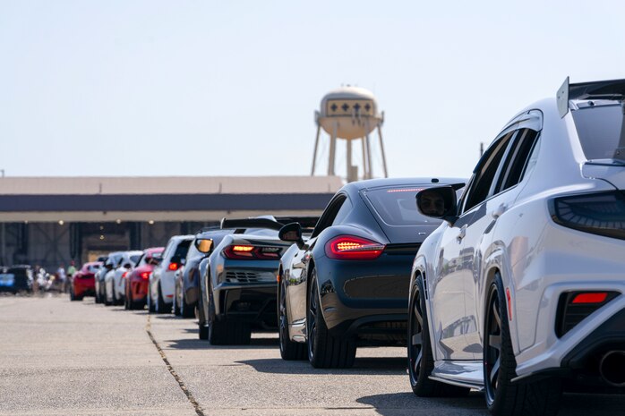 A line of vehicles returning from having their photo taken alongside the U-2 Dragon Lady wait for directions on where to park during the Beale Auto Expo, May 18, 2024, at Beale Air Force Base, California.