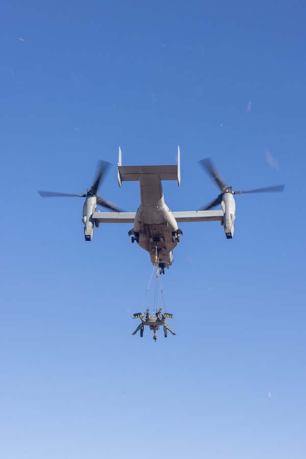 A U.S. Marine Corps MV-22B Osprey assigned to Marine Medium Tiltrotor Squadron (VMM) 364, Marine Aircraft Group 39, 3rd Marine Aircraft Wing, detaches an M777A2 lightweight 155 mm howitzer at Marine Corps Base Camp Pendleton, California, Jan. 14, 2025. VMM-364; 1st Distribution Support Battalion, Combat Logistics Regiment 1, 1st Marine Logistics Group; and 2nd Battalion, 11th Marine Regiment, 1st Marine Division executed a dual-point external lift exercise to enhance logistical proficiency, strengthening the ability to support the Marine Expeditionary Force by efficiently distributing personnel, equipment, and supplies. (U.S. Marine Corps photo by Lance Cpl. Jennifer Sanchez)