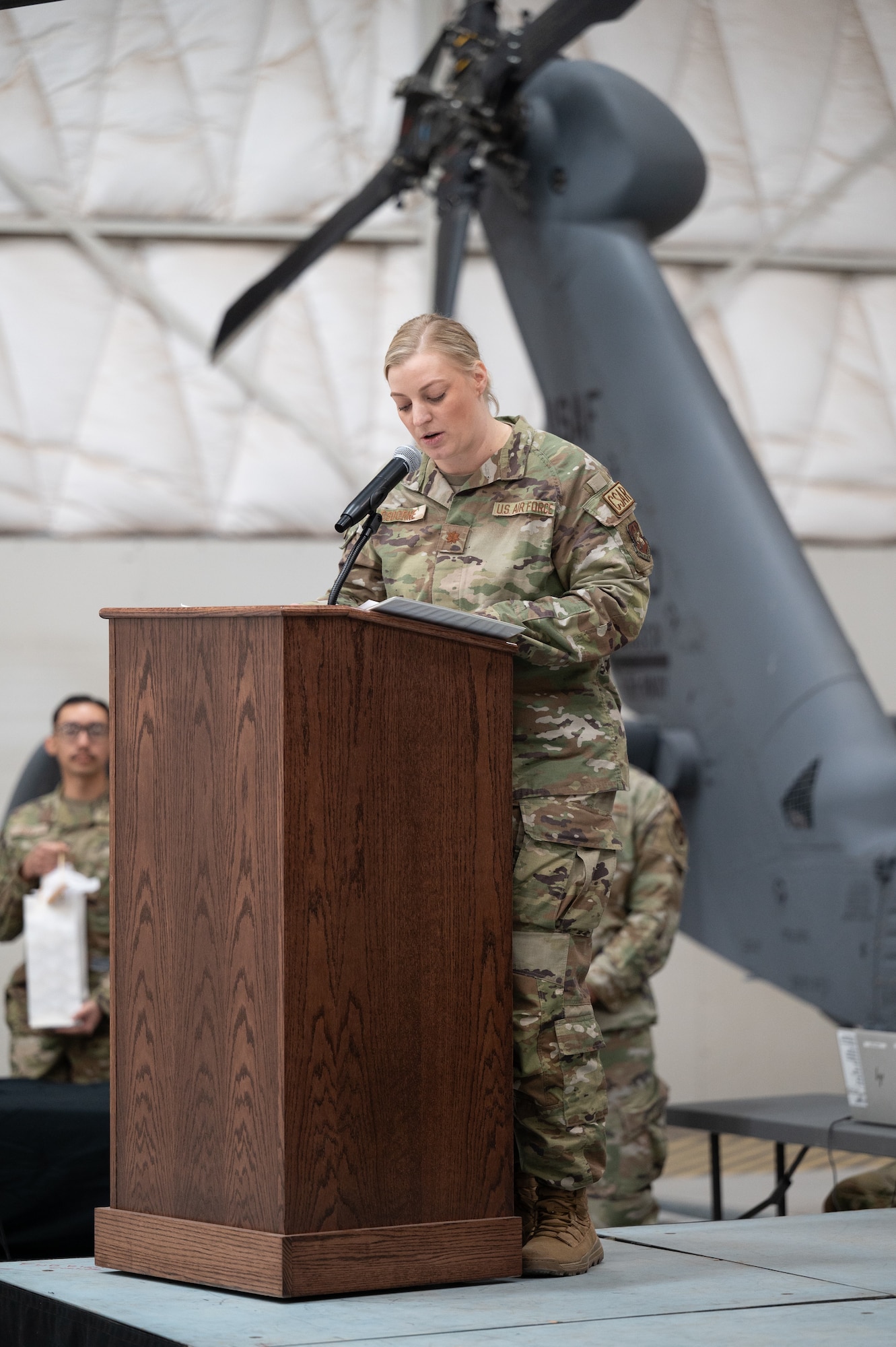 Maj. Amber Osborne addresses Airmen.